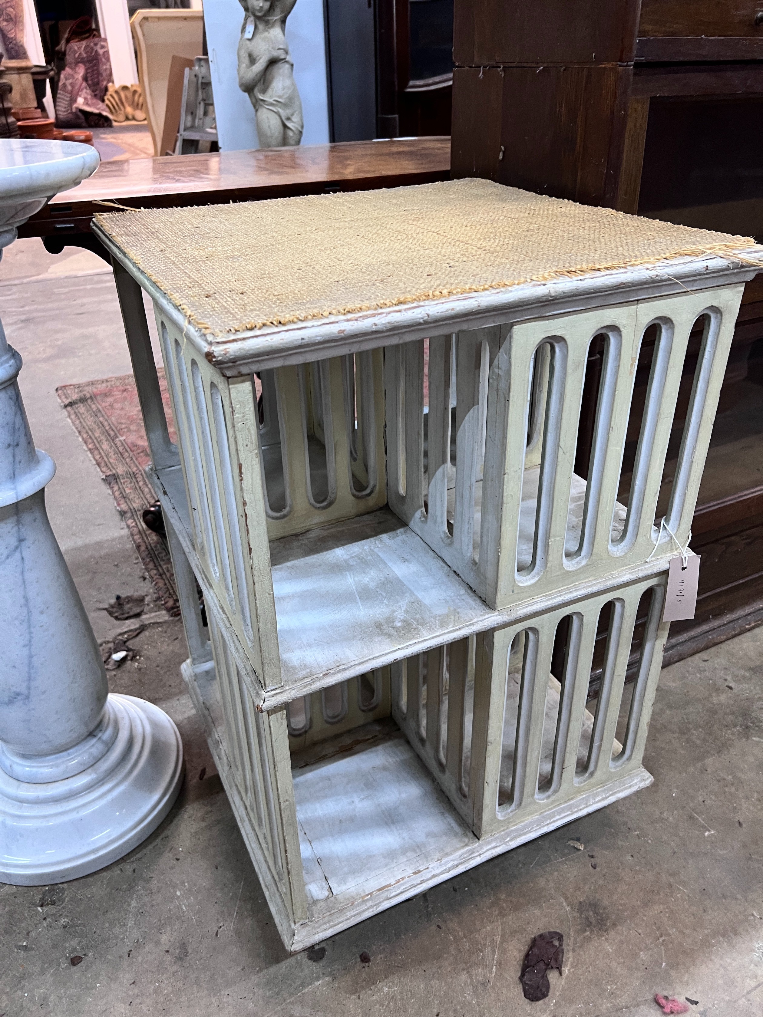 A painted revolving bookcase, width 47cm, height 73cm *Please note the sale commences at 9am.
